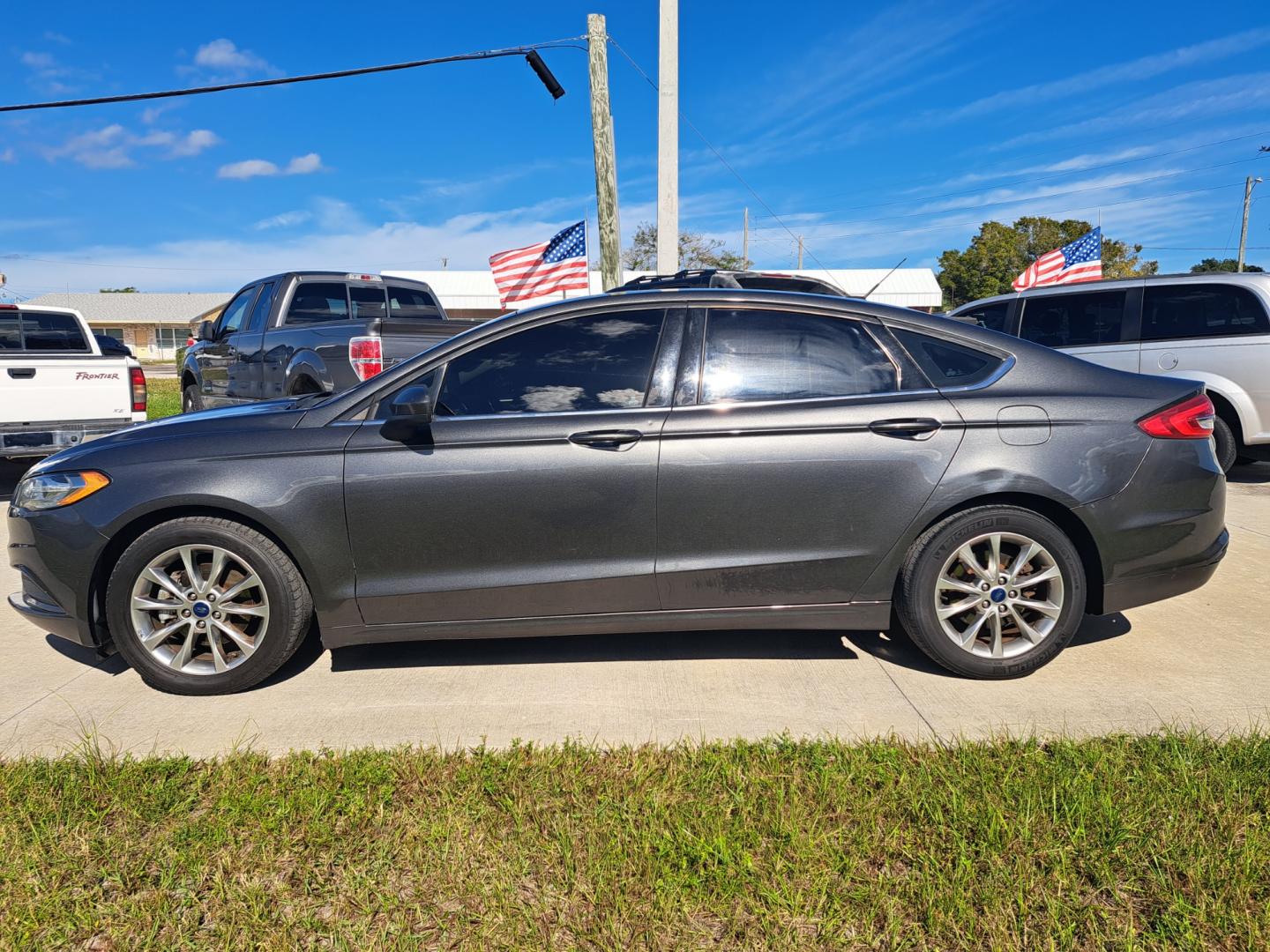 2017 Grey /BLACK Ford Fusion SE (3FA6P0H70HR) with an 2.5L L4 DOHC 16V engine, 6A transmission, located at 1181 Aurora Rd, Melbourne, FL, 32935, (321) 241-1100, 28.132914, -80.639175 - Photo#0